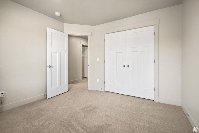 4488 S Haven Creek Rd W Unit 25D, West Haven, UT 84401 - unfurnished bedroom featuring carpet floors, baseboards, and a closet