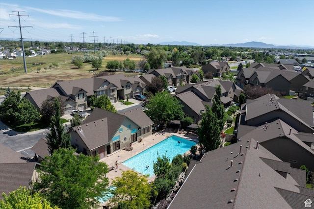 4488 S Haven Creek Rd W Unit 25D, West Haven, UT 84401 - aerial perspective of suburban area featuring a pool and a mountainous background