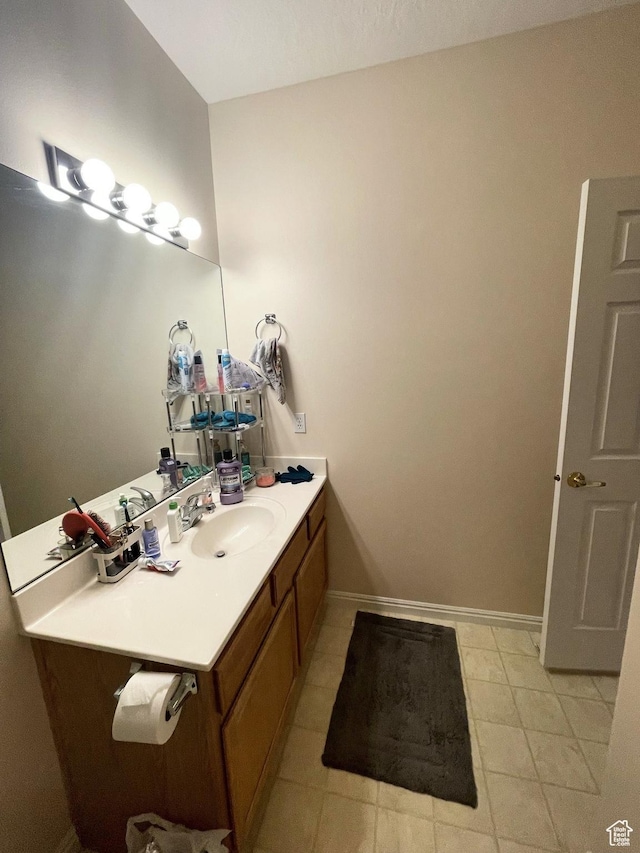 3400 E Hidden Springs Dr, Washington, UT 84780 - bathroom with vanity, baseboards, and tile patterned flooring