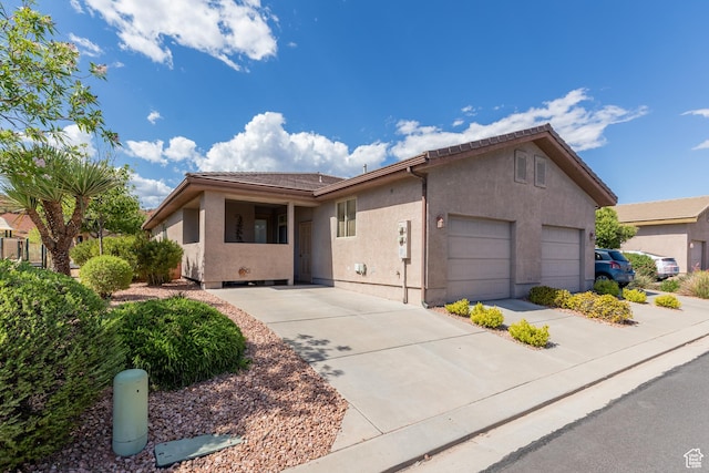 3400 E Hidden Springs Dr, Washington, UT 84780 - ranch-style home featuring stucco siding, a garage, and concrete driveway