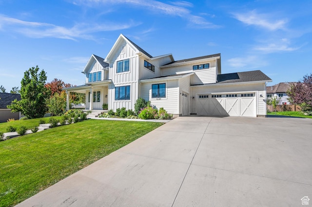 12387 Timberline Dr Unit 53, Highland, UT 84003 - modern farmhouse featuring board and batten siding, covered porch, an attached garage, driveway, and a front lawn
