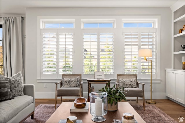 12387 Timberline Dr Unit 53, Highland, UT 84003 - living area featuring wood finished floors, plenty of natural light, and baseboards