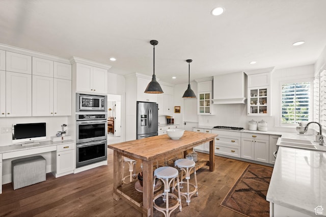 12387 Timberline Dr Unit 53, Highland, UT 84003 - kitchen with appliances with stainless steel finishes, a sink, dark wood-style flooring, white cabinetry, and recessed lighting