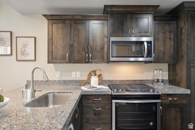 13609 N Hill Climb Ln, Kamas, UT 84036 - kitchen featuring stainless steel microwave, stove, a sink, and dark brown cabinets