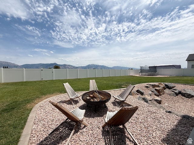1852 N 4100 W, Plain City, UT 84404 - view of yard with a fire pit, a trampoline, and a mountain view