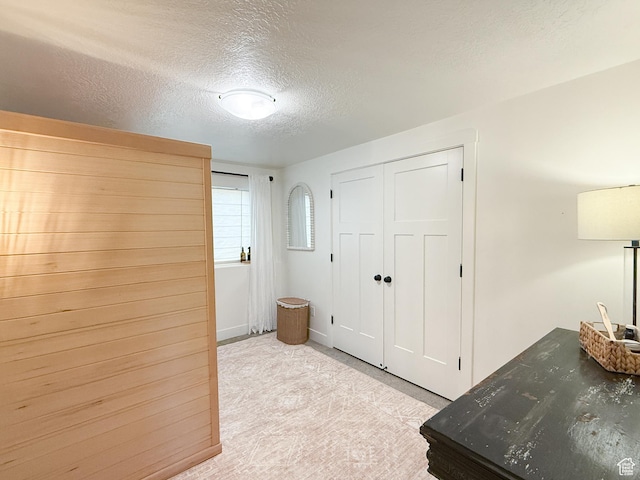 1852 N 4100 W, Plain City, UT 84404 - bedroom featuring a textured ceiling, light carpet, and a closet