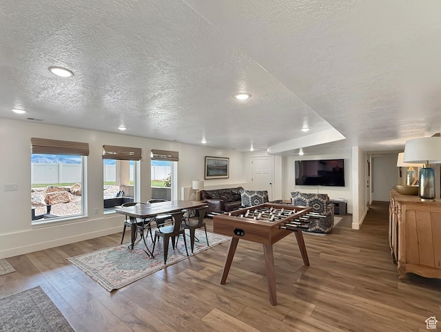 1852 N 4100 W, Plain City, UT 84404 - playroom featuring a textured ceiling, wood finished floors, baseboards, and recessed lighting