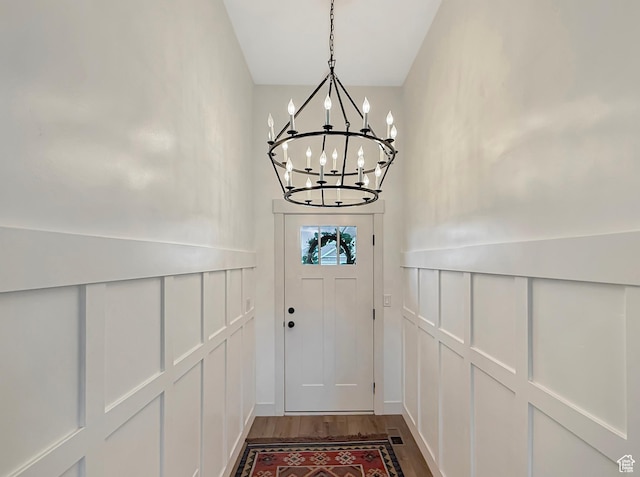 1852 N 4100 W, Plain City, UT 84404 - doorway featuring a chandelier, a decorative wall, and dark wood-style floors