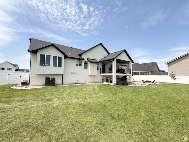 1852 N 4100 W, Plain City, UT 84404 - rear view of house with a balcony, stucco siding, a patio, and central AC