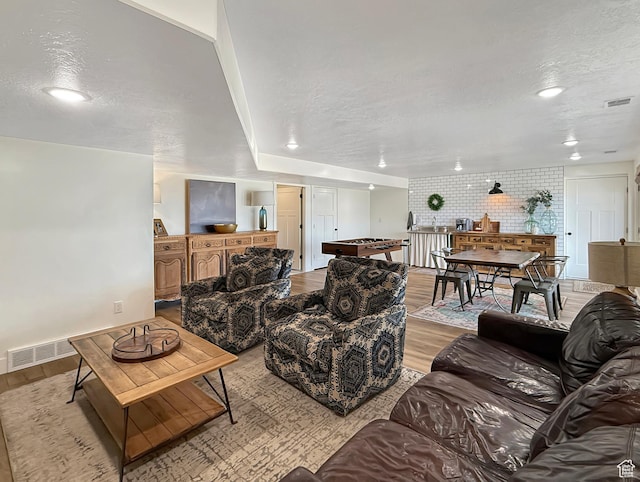 1852 N 4100 W, Plain City, UT 84404 - living room featuring light wood-style floors, a textured ceiling, and recessed lighting