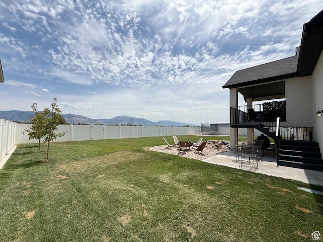 1852 N 4100 W, Plain City, UT 84404 - view of yard featuring stairway, a mountain view, a patio area, and an outdoor fire pit