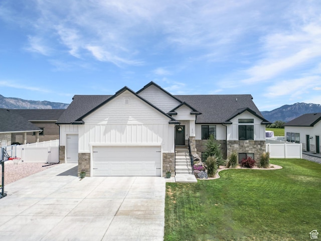 1852 N 4100 W, Plain City, UT 84404 - modern farmhouse style home with stone siding, board and batten siding, driveway, a garage, and a mountain view
