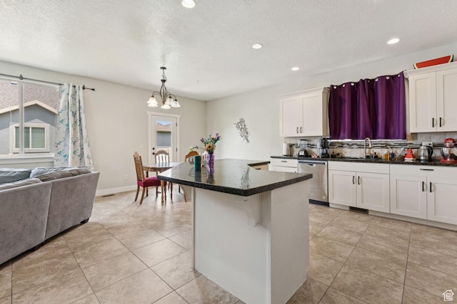 301 E Salem Park Cir, Salem, UT 84653 - kitchen featuring dishwasher, a sink, a chandelier, tasteful backsplash, and a center island