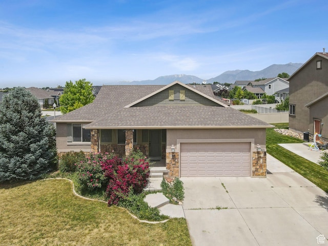 301 E Salem Park Cir, Salem, UT 84653 - view of front facade with roof with shingles, stone siding, and a mountain view