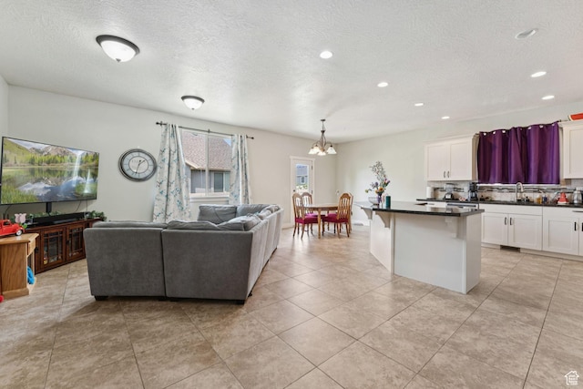 301 E Salem Park Cir, Salem, UT 84653 - living room featuring a chandelier, a textured ceiling, recessed lighting, and light tile patterned floors