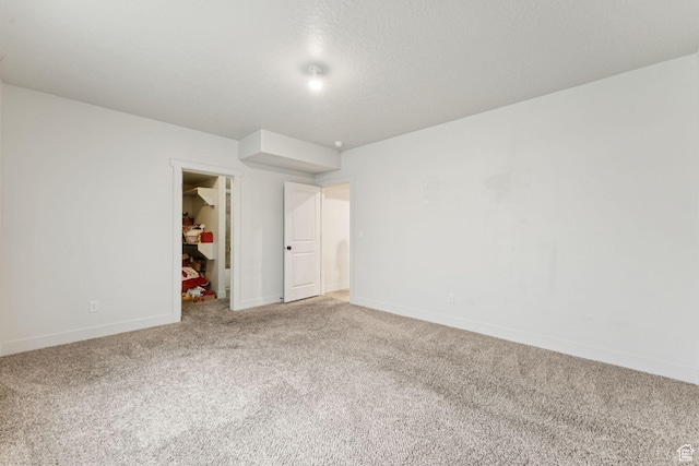 301 E Salem Park Cir, Salem, UT 84653 - unfurnished bedroom featuring carpet flooring, a spacious closet, baseboards, and a closet
