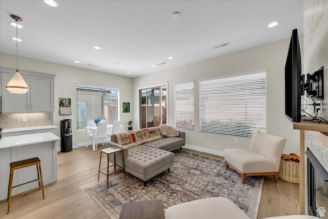 1210 W Ledgerwood Dr, St George, UT 84790 - living area with light wood-style floors, recessed lighting, and baseboards