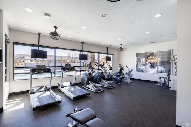 1210 W Ledgerwood Dr, St George, UT 84790 - exercise room featuring a textured ceiling, recessed lighting, and baseboards