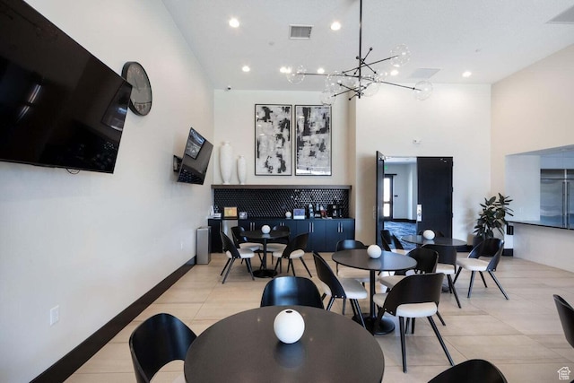 1210 W Ledgerwood Dr, St George, UT 84790 - dining room with a chandelier, a towering ceiling, light tile patterned floors, and recessed lighting