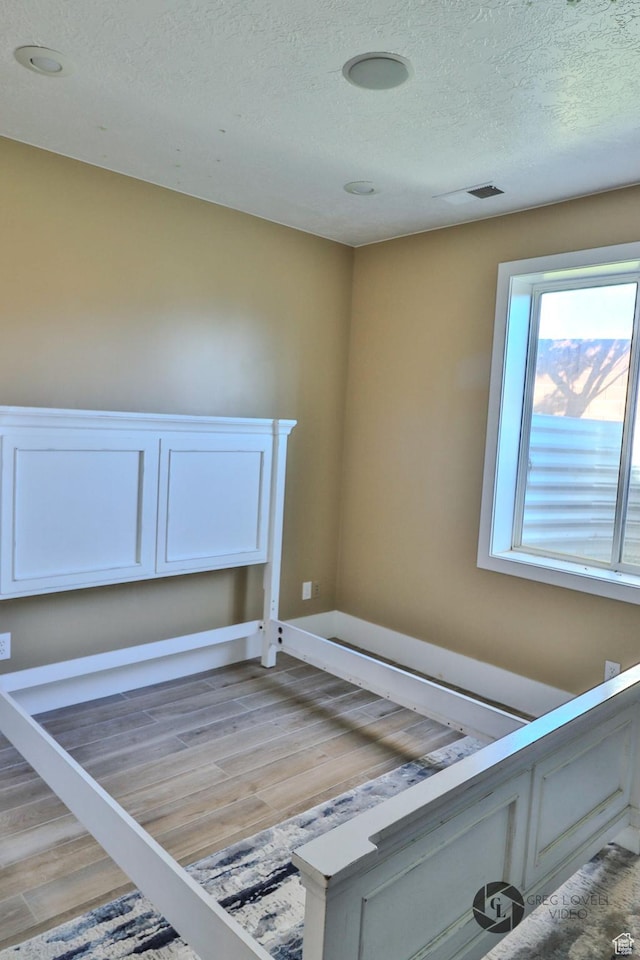 692 E 5020 N, Enoch, UT 84721 - detailed view of wood finished floors and a textured ceiling