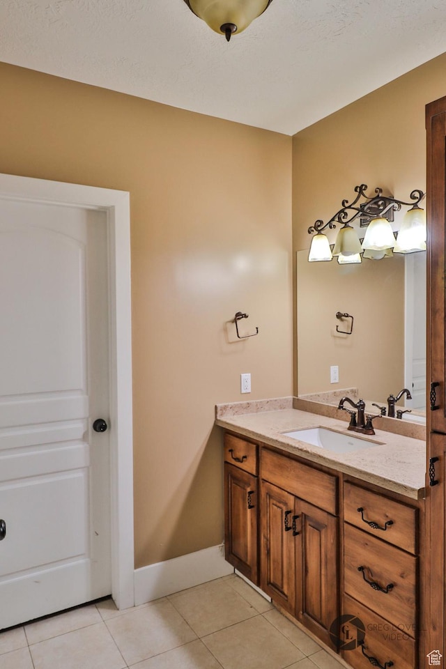692 E 5020 N, Enoch, UT 84721 - bathroom featuring vanity, tile patterned flooring, and baseboards