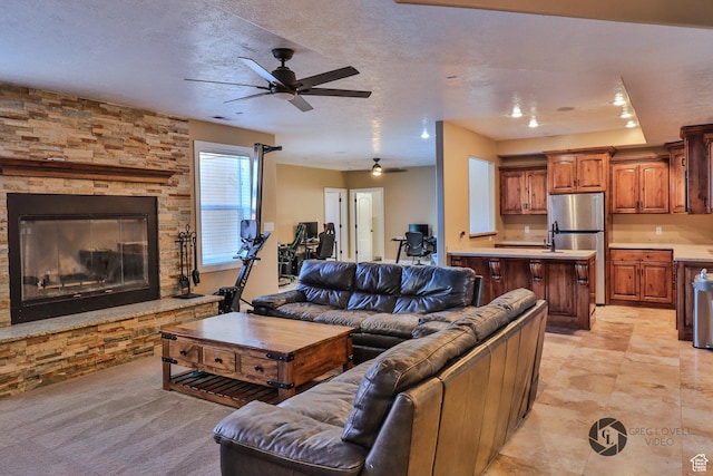 692 E 5020 N, Enoch, UT 84721 - living area with a ceiling fan and a fireplace