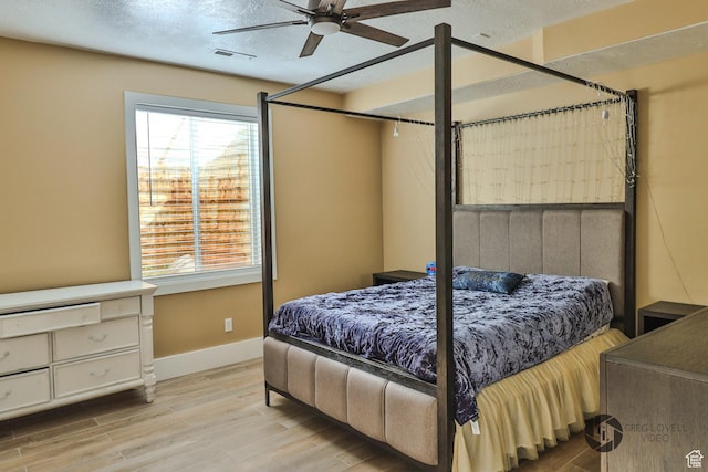 692 E 5020 N, Enoch, UT 84721 - bedroom with wood finished floors, baseboards, ceiling fan, and a textured ceiling