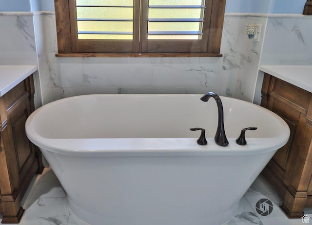 692 E 5020 N, Enoch, UT 84721 - bathroom with marble look tile flooring, vanity, and healthy amount of natural light