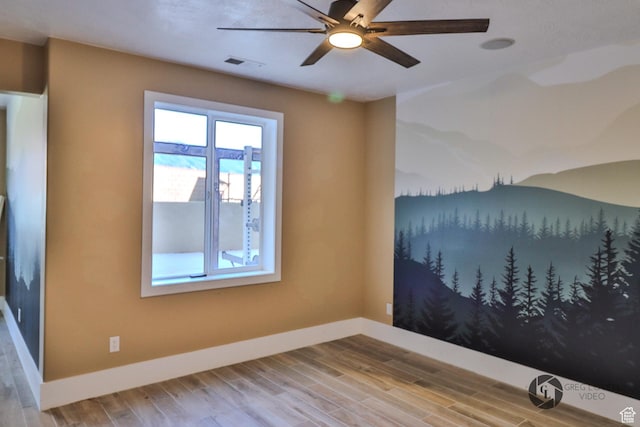692 E 5020 N, Enoch, UT 84721 - spare room with baseboards, ceiling fan, and wood finished floors