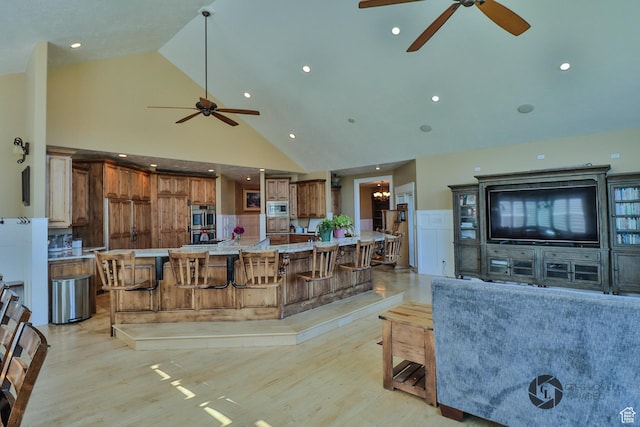 692 E 5020 N, Enoch, UT 84721 - living room featuring ceiling fan, high vaulted ceiling, light wood finished floors, and recessed lighting