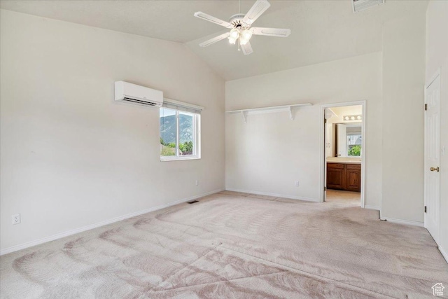 497 E 3525 N, North Ogden, UT 84414 - unfurnished bedroom featuring a wall unit AC, light colored carpet, baseboards, ensuite bath, and high vaulted ceiling