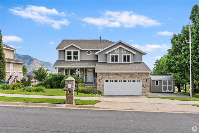 497 E 3525 N, North Ogden, UT 84414 - view of front facade with a garage, a mountain view, concrete driveway, and a shingled roof