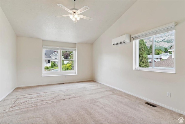 497 E 3525 N, North Ogden, UT 84414 - spare room with a wall mounted AC, carpet flooring, vaulted ceiling, ceiling fan, and baseboards
