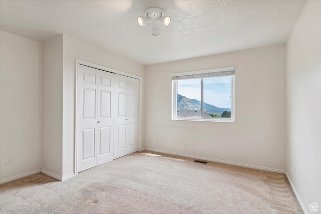 497 E 3525 N, North Ogden, UT 84414 - unfurnished bedroom with carpet flooring, a closet, and baseboards