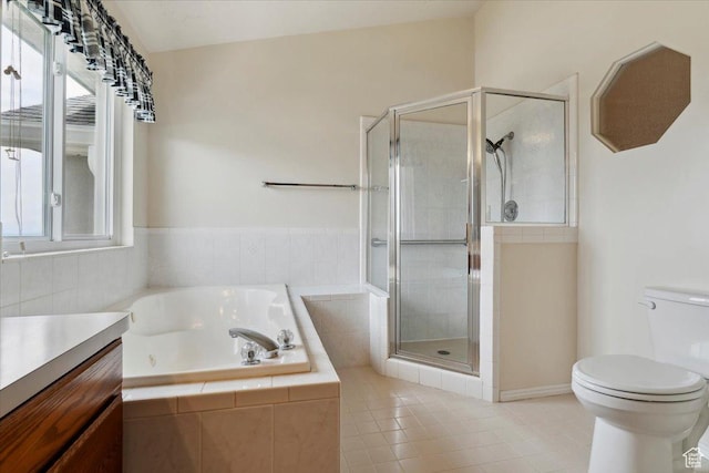 497 E 3525 N, North Ogden, UT 84414 - full bathroom featuring a garden tub, tile patterned floors, toilet, a stall shower, and vanity