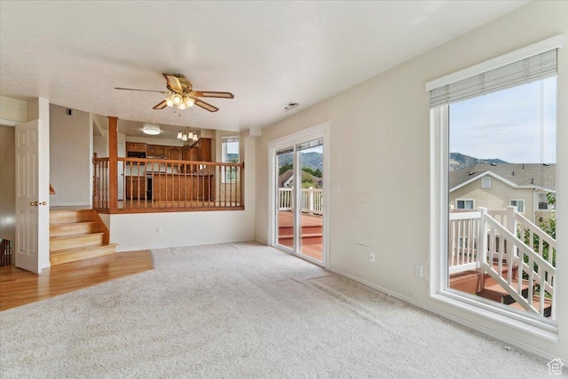 497 E 3525 N, North Ogden, UT 84414 - unfurnished living room with carpet flooring, stairs, a ceiling fan, and baseboards