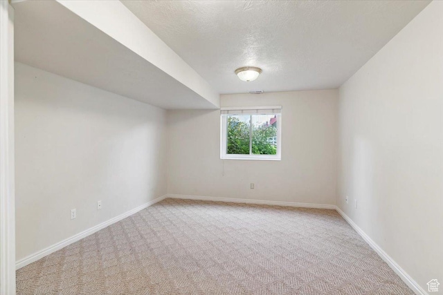 497 E 3525 N, North Ogden, UT 84414 - carpeted spare room with a textured ceiling and baseboards