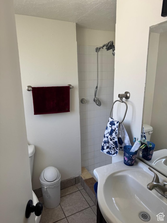 1102 W 860 N, Provo, UT 84604 - full bathroom with tiled shower, tile patterned floors, and a textured ceiling