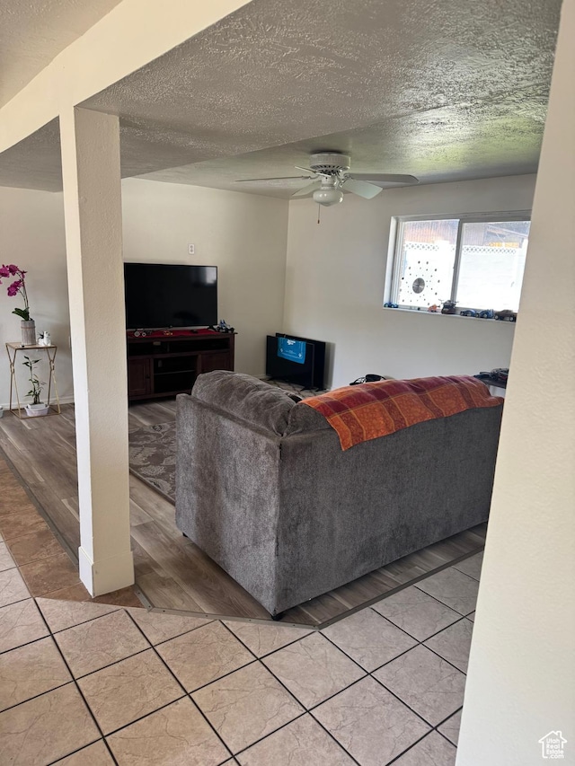 1102 W 860 N, Provo, UT 84604 - living room featuring ceiling fan, a textured ceiling, and light tile patterned floors