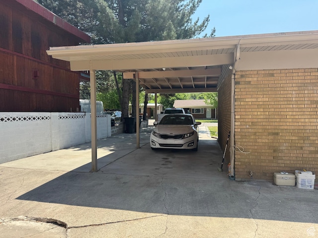 1102 W 860 N, Provo, UT 84604 - view of parking / parking lot featuring concrete driveway and a carport