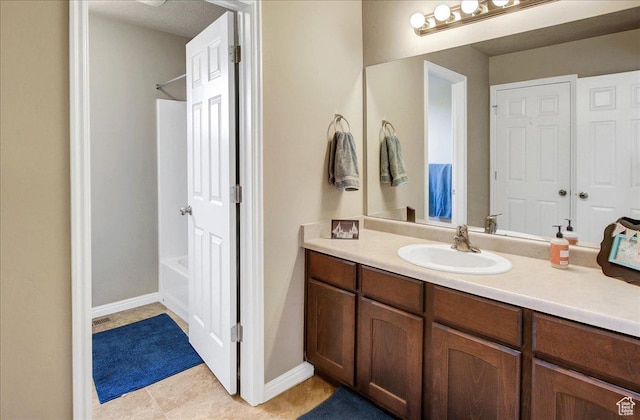 2118 W Foxwood St, West Haven, UT 84401 - full bathroom featuring vanity, shower / washtub combination, tile patterned flooring, and baseboards