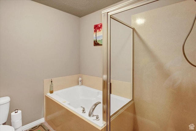 2118 W Foxwood St, West Haven, UT 84401 - bathroom featuring toilet, a garden tub, a shower with shower door, a textured ceiling, and baseboards
