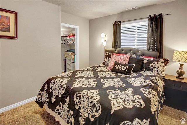 2118 W Foxwood St, West Haven, UT 84401 - bedroom with carpet floors, a walk in closet, baseboards, and a closet