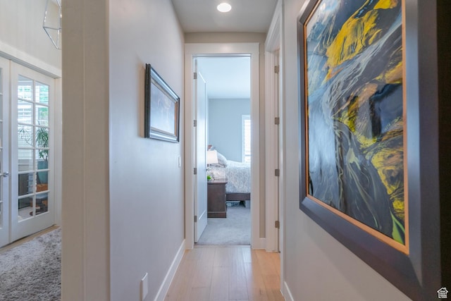 2573 S 3160 E, St George, UT 84790 - hall featuring light wood finished floors, french doors, and baseboards