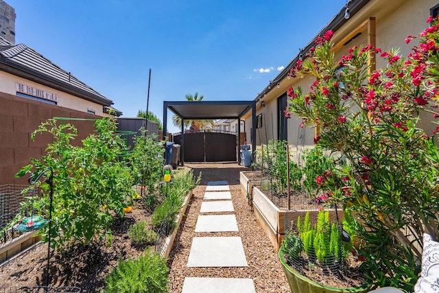 2573 S 3160 E, St George, UT 84790 - fenced yard featuring a vegetable garden and a gate
