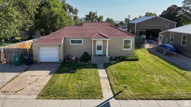 584 E Maple St S, Clearfield, UT 84015 - view of front facade featuring a tile roof, concrete driveway, and a garage