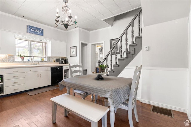 125 W 300 S, Ephraim, UT 84627 - dining area with a chandelier, wood finished floors, ornamental molding, and stairs