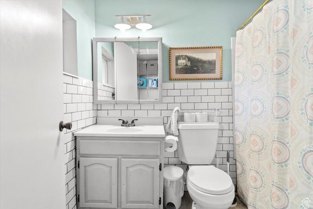 125 W 300 S, Ephraim, UT 84627 - bathroom with tile walls, toilet, vanity, tasteful backsplash, and a shower with curtain