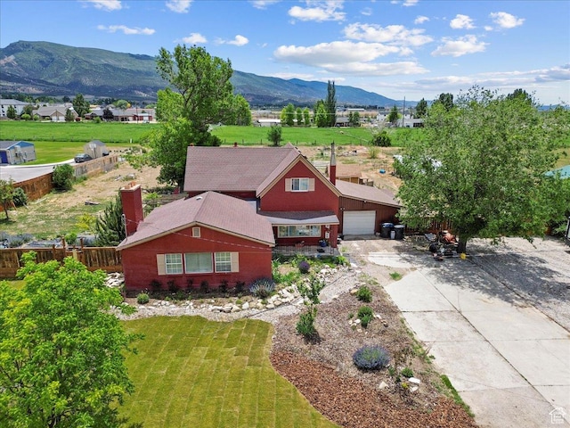 125 W 300 S, Ephraim, UT 84627 - view of front of house with a mountain view, concrete driveway, and a garage