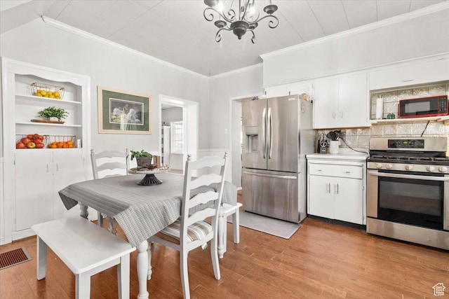 125 W 300 S, Ephraim, UT 84627 - kitchen featuring stainless steel appliances, crown molding, a chandelier, light wood-type flooring, and white cabinets